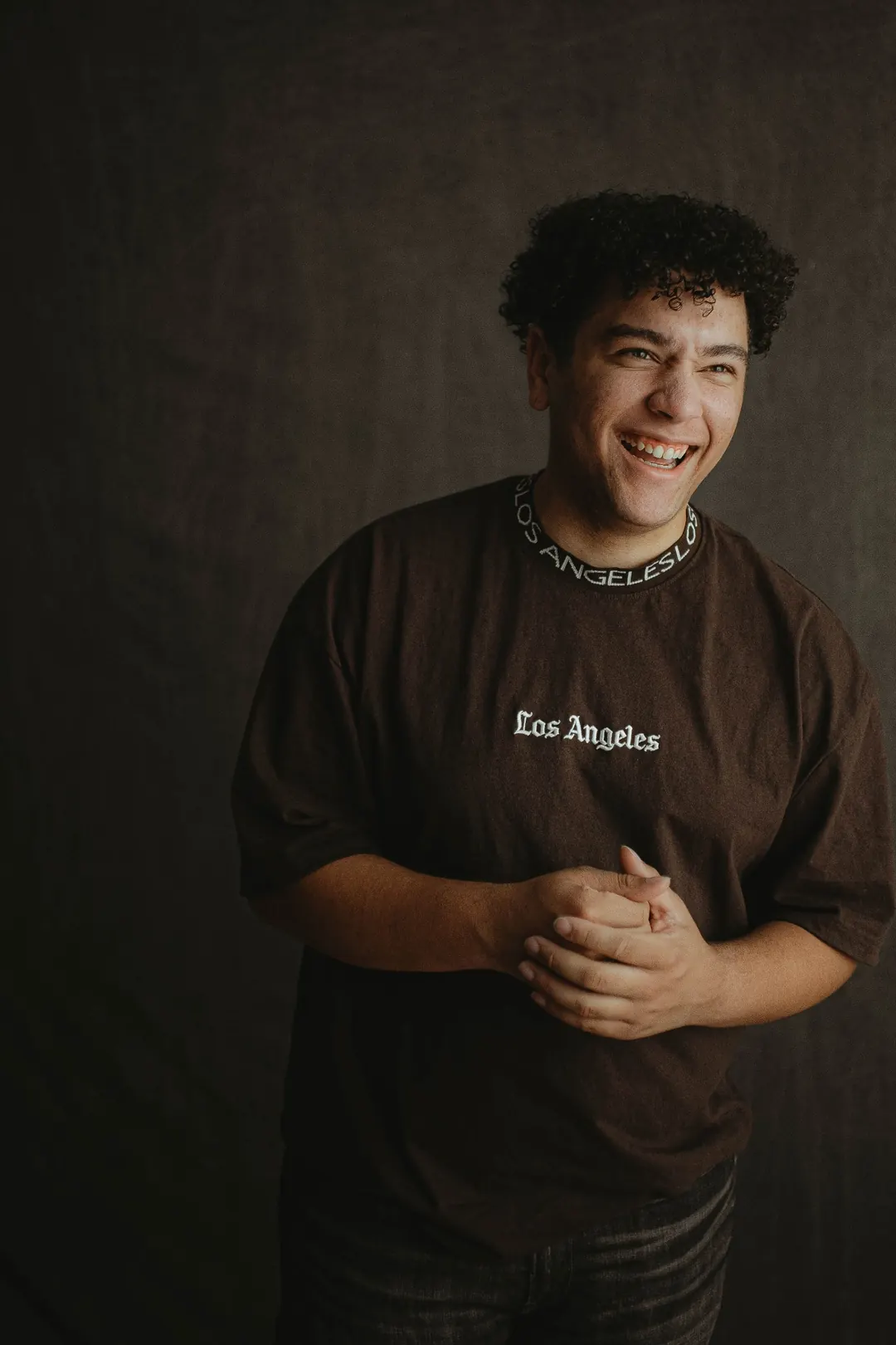 Will Smith laughing in a studio portrait